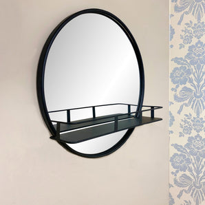 Circular Black Metal Framed Mirror With Shelf