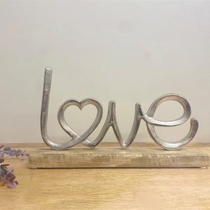 Metal Silver Love Ornament On A Wooden Base