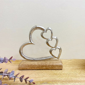 Metal Silver Four Heart Ornament On A Wooden Base Small